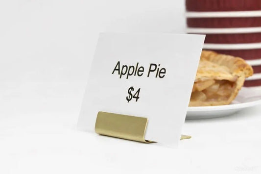 Brass name card holder displaying Apple Pie price card