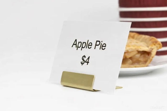 Brass name card holder displaying Apple Pie price card