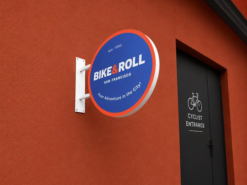 Blue custom round blade sign for bicycle shop storefront