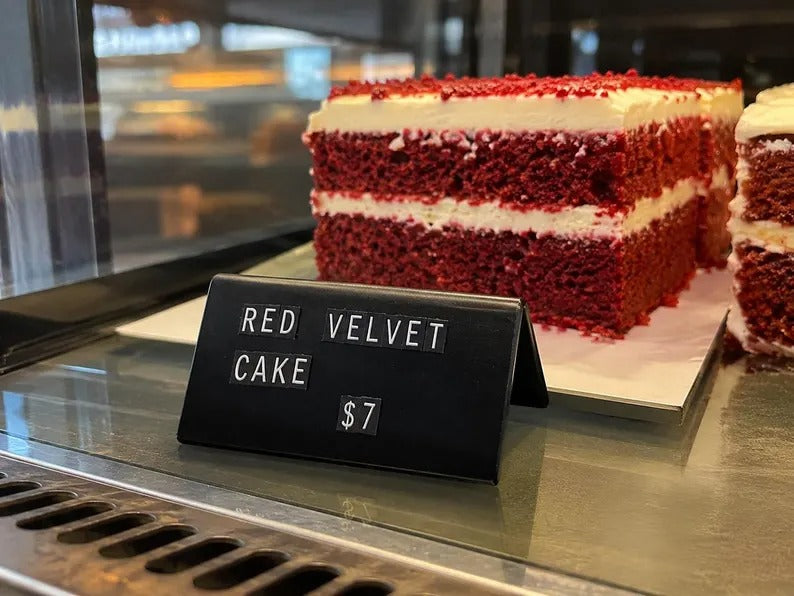Magnetic buffet label with changeable letters beside red velvet cake